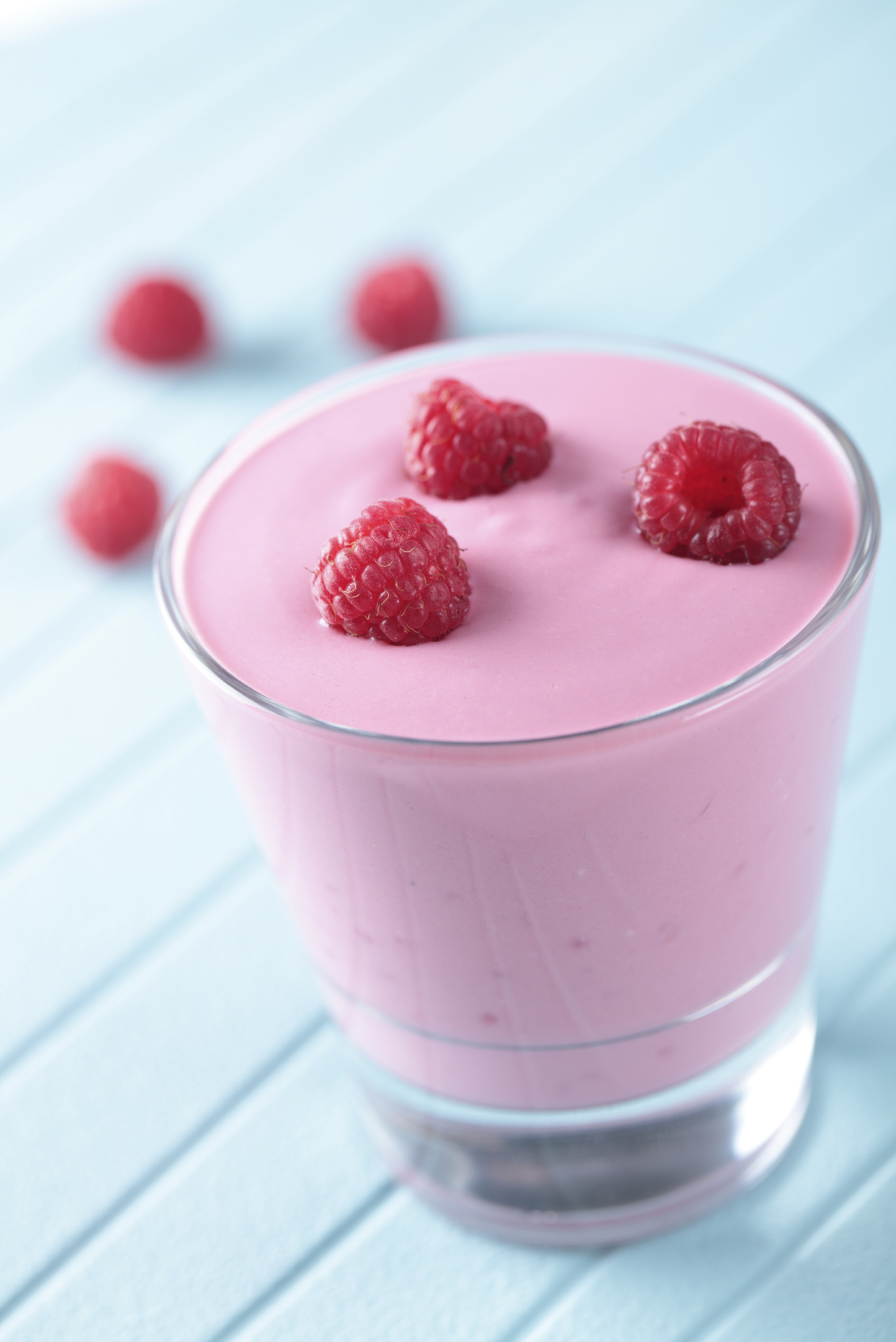 Raspberry smoothie in a glass closeup